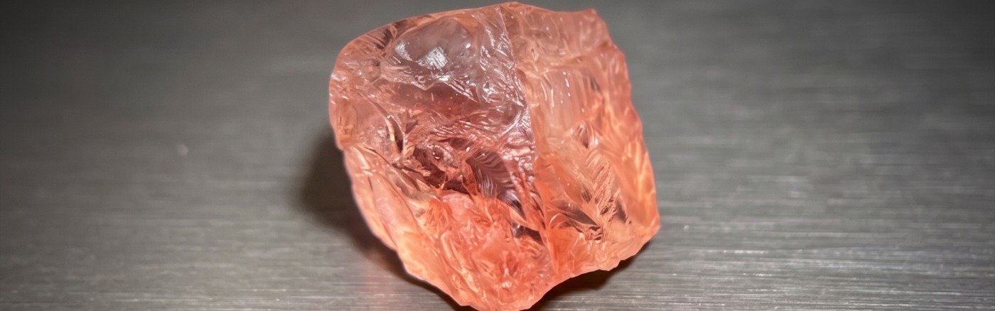 An uncut piece of rough gemstone crystal